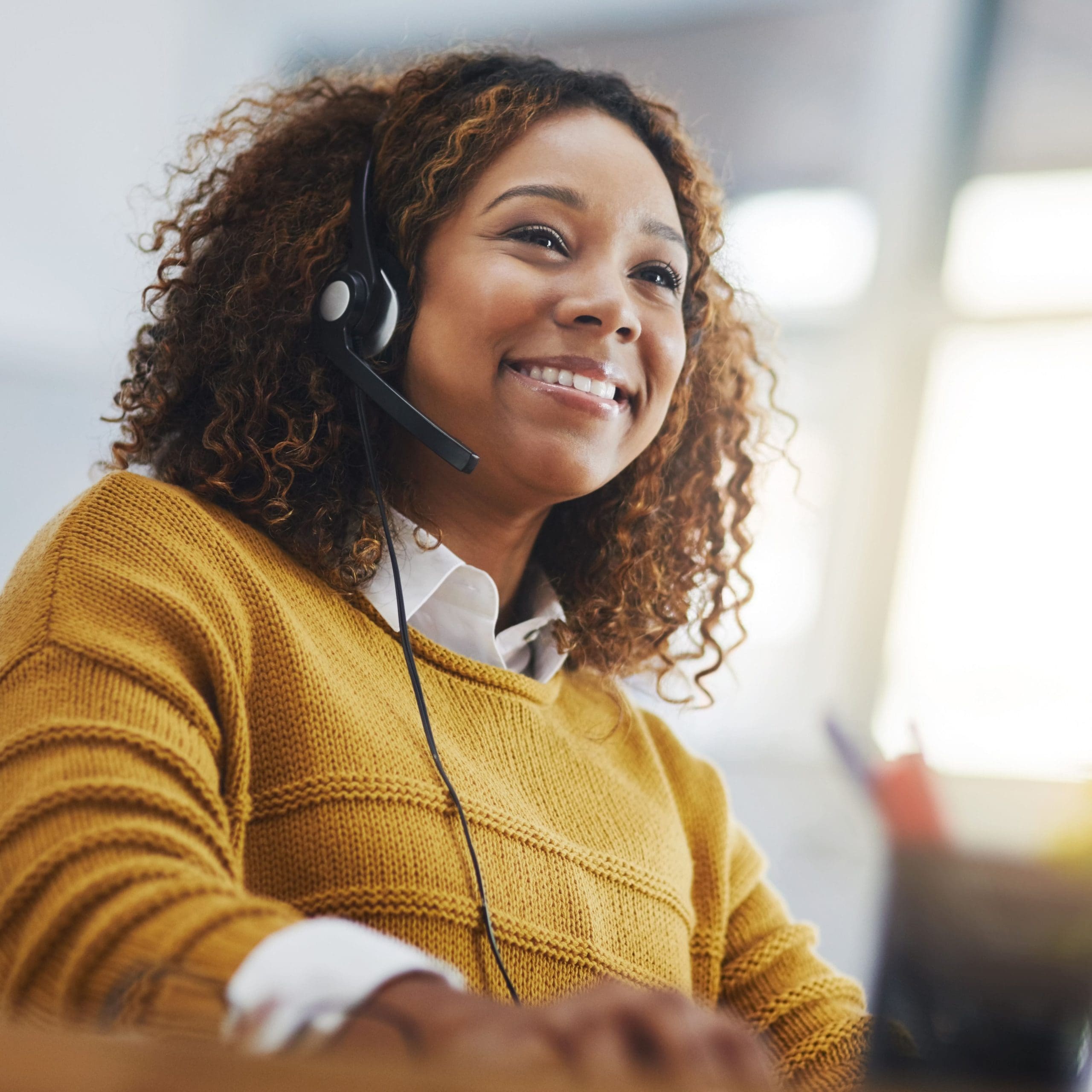 A woman talking on a headset.