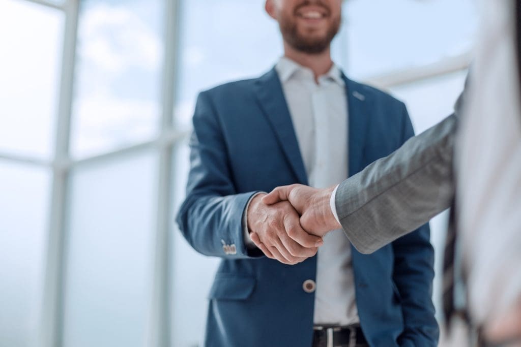 business partners shaking hands concept of partnership