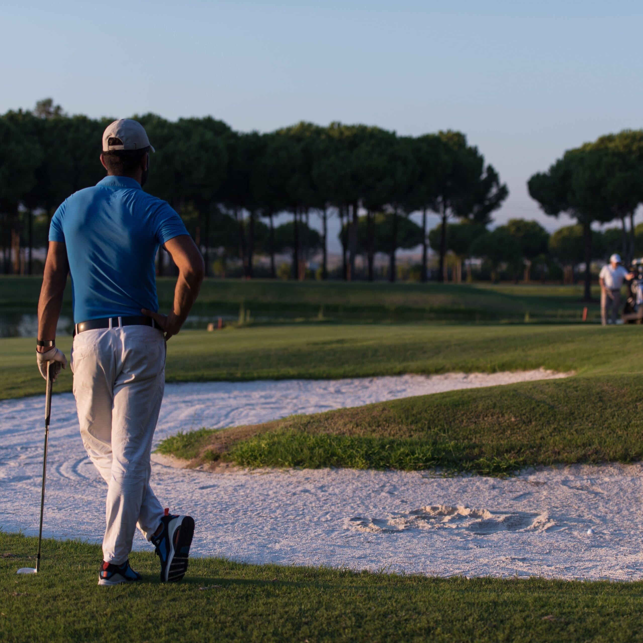 golfer from back at course looking to hole in distance