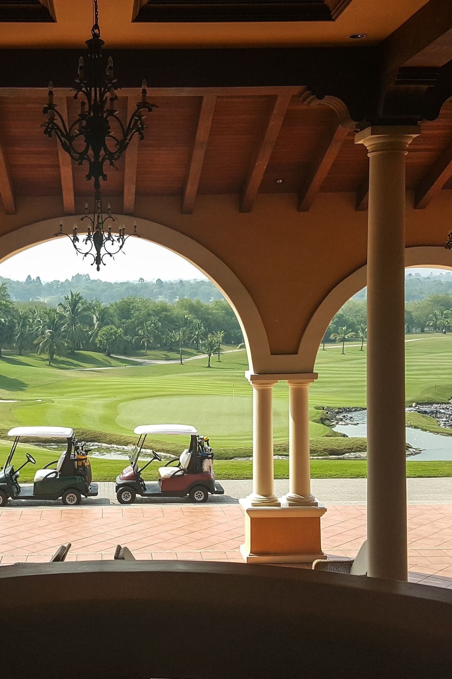 row of golf car stand by golf course