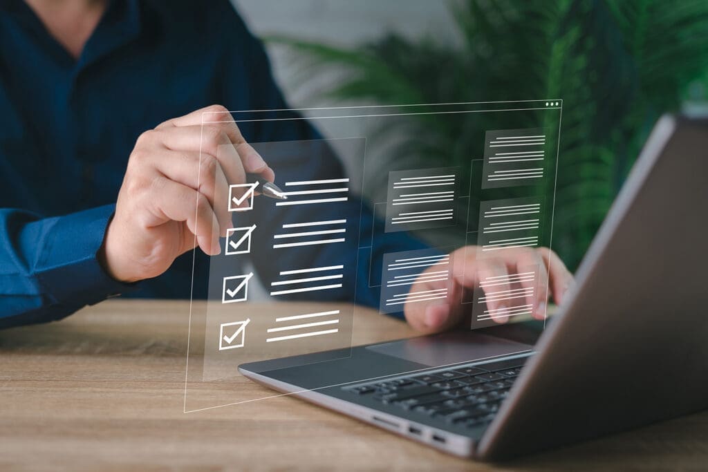 A businessman reviewing digital documents for cybersecurity compliance