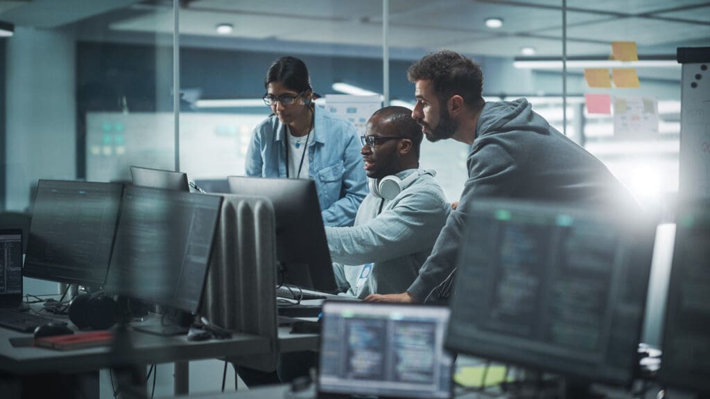 A group of IT professionals testing a cyber incident response plan.